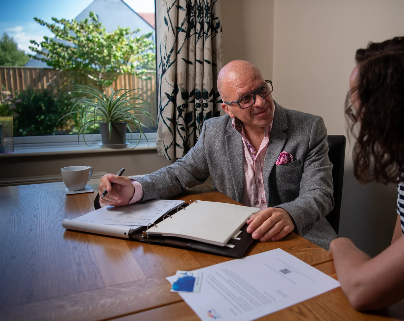 Allan Vincent in conversation during a funeral planning meeting